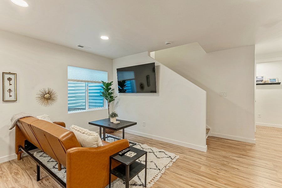 View of living area and staircase leading to Foyer. 
