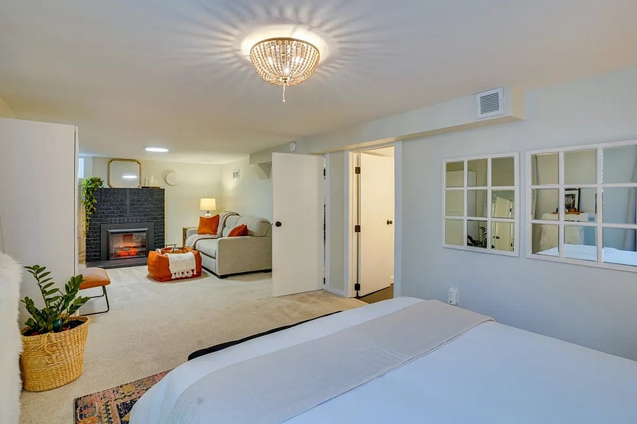 master bedroom with electric fireplace