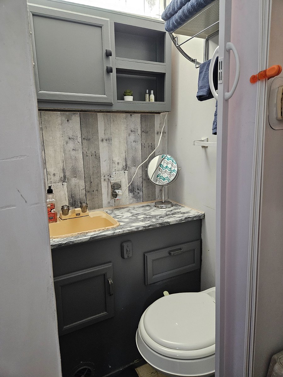 Tiny bathroom with shower. Lots of hot water though! Two towels per person provided and starter toiletries.