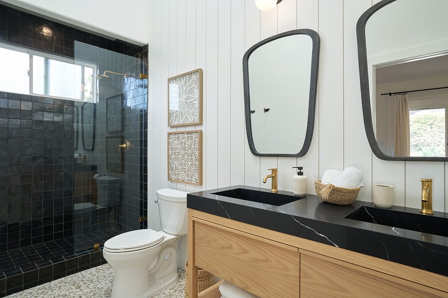 Master bathroom with dual vanity sinks and walk in shower.