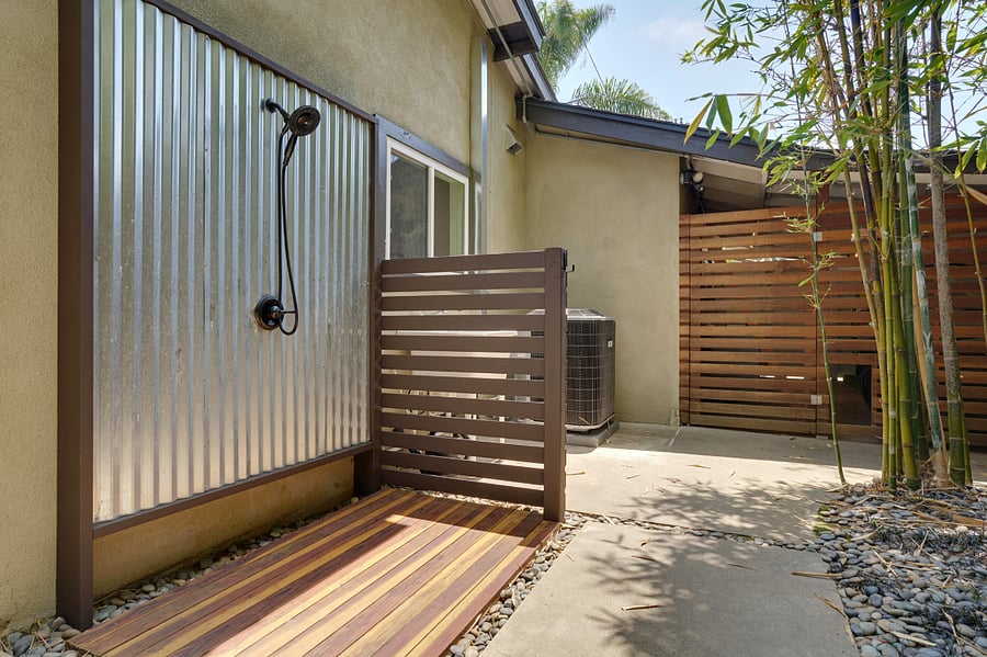 Outdoor shower after the jacuzzi or beach.