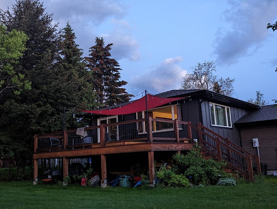 Expansive back deck overlooking yard with mountain view
