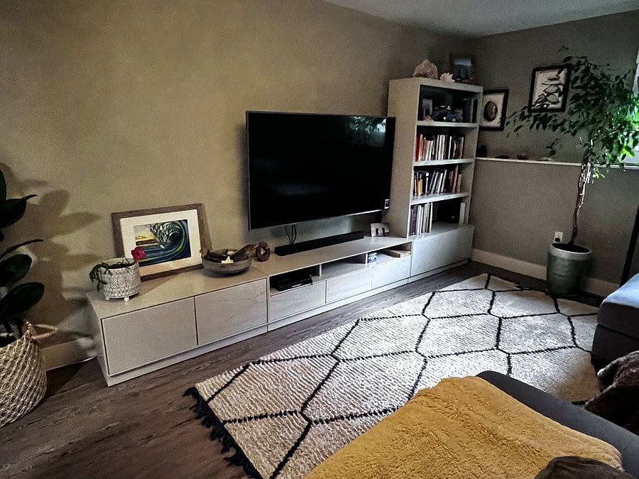 Smart Tv with surround sound, gaming console, and storage