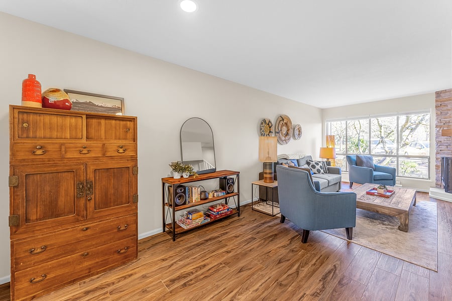 Beautifully appointed furniture, bookshelf stocked with games, books and sound system.