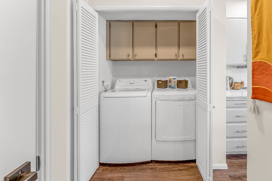 Full-size washer dryer off of kitchen