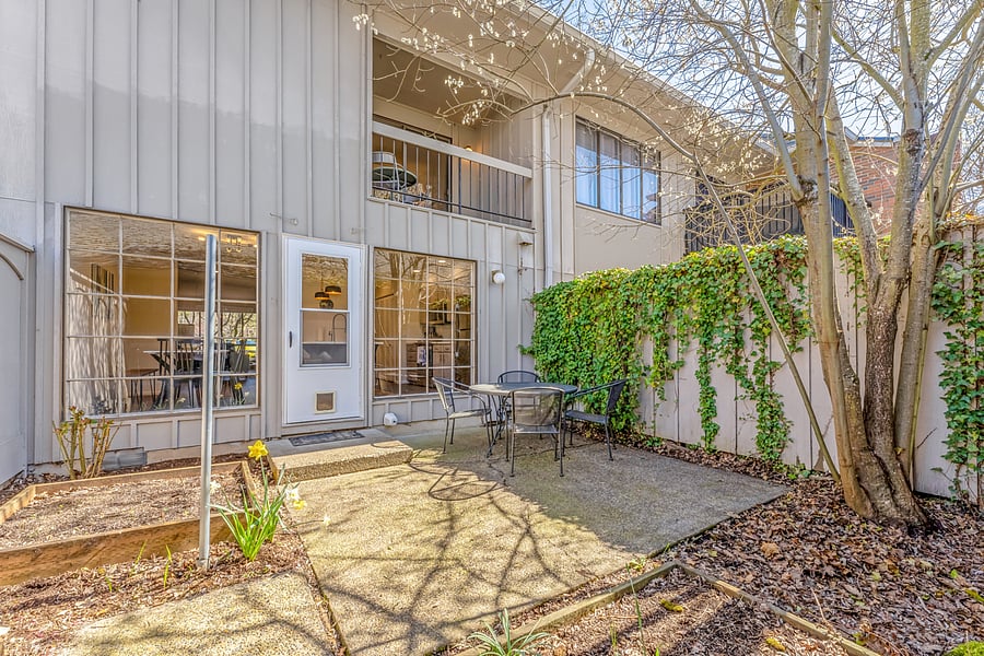 Private outdoor patio off of kitchen with garden beds to use
