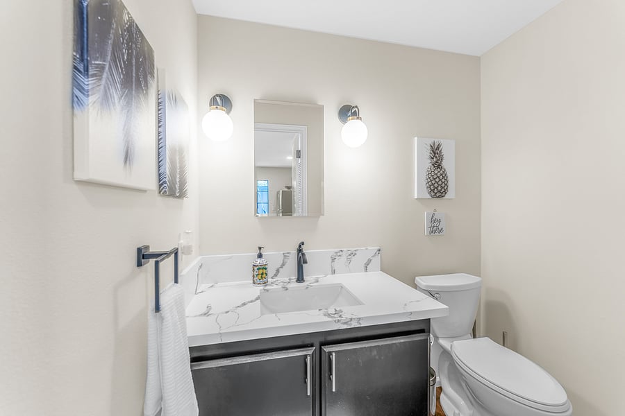 Downstairs half bath off of kitchen area
