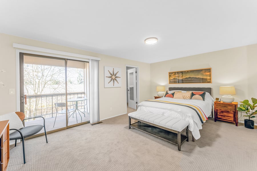 Small covered balcony off of primary bedroom.