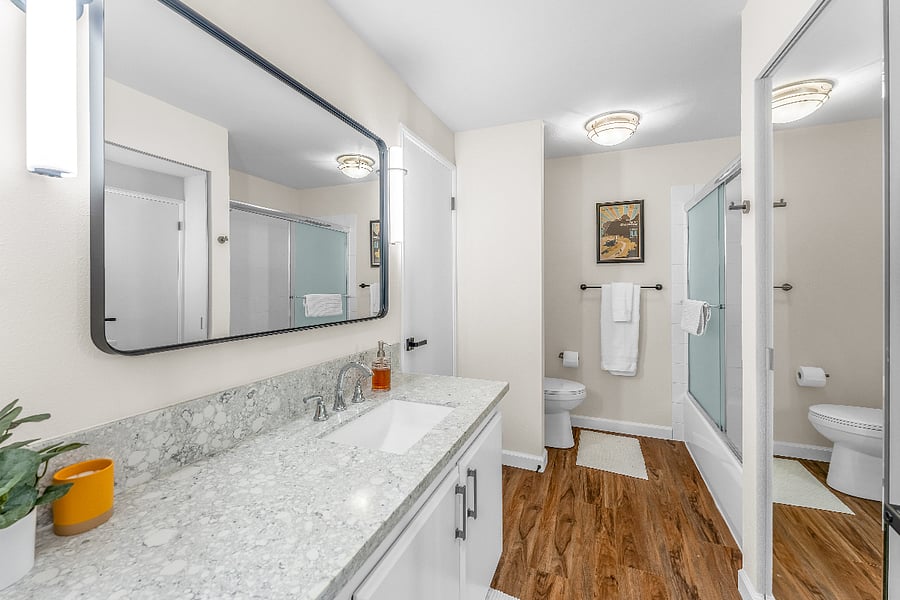 Upstairs full bath, accessible from the primary bedroom as well as the hall.