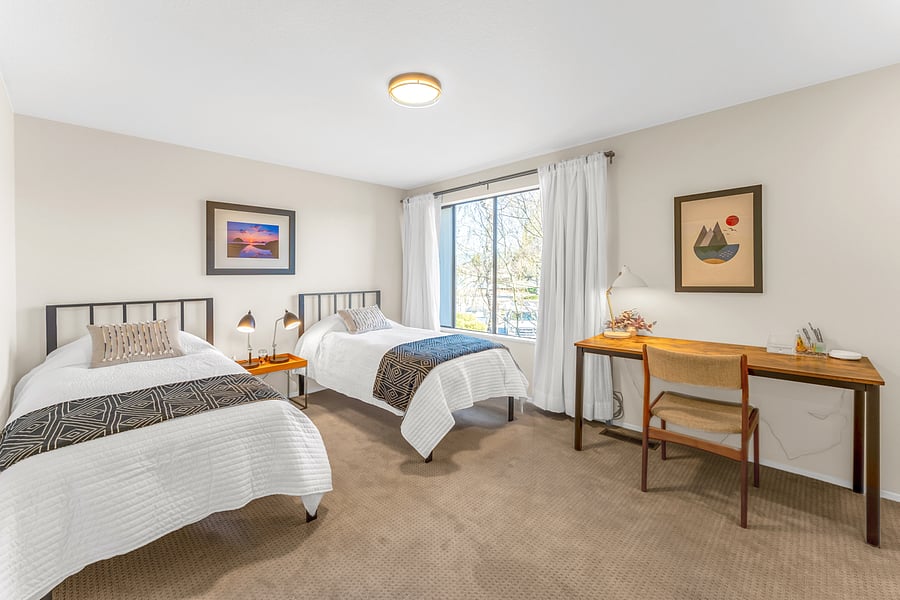 Two twin beds with working space
