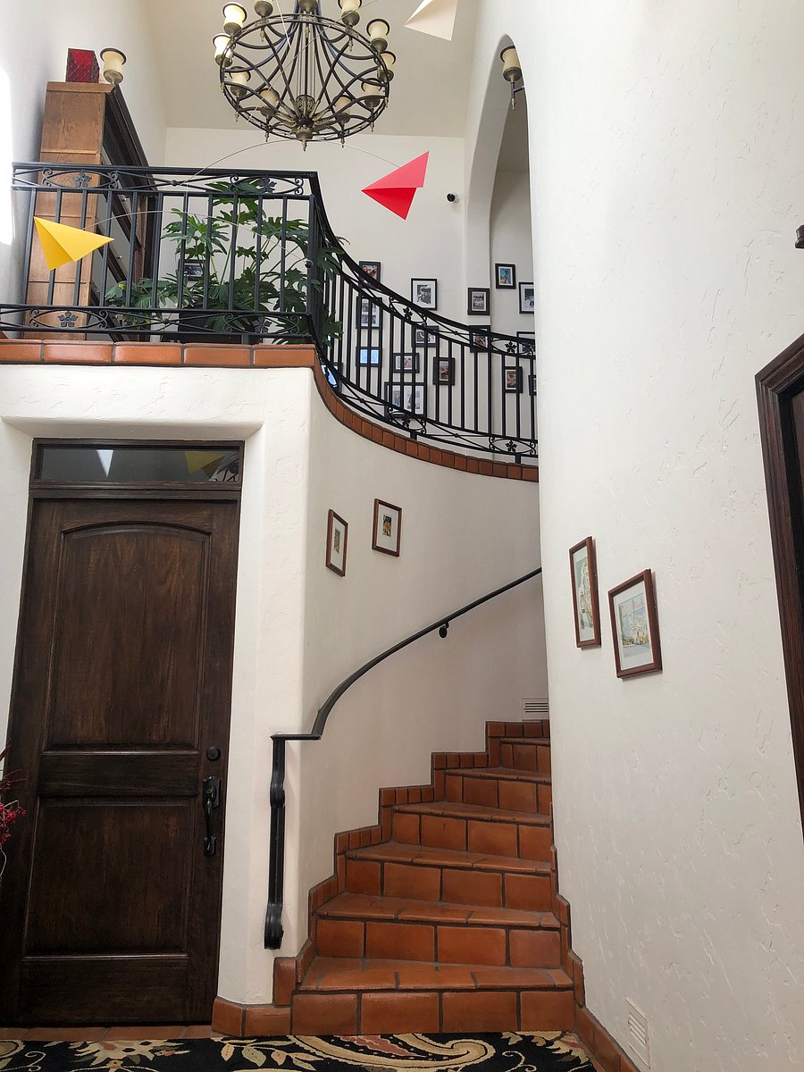 Curved stairs lead to your private apartment.