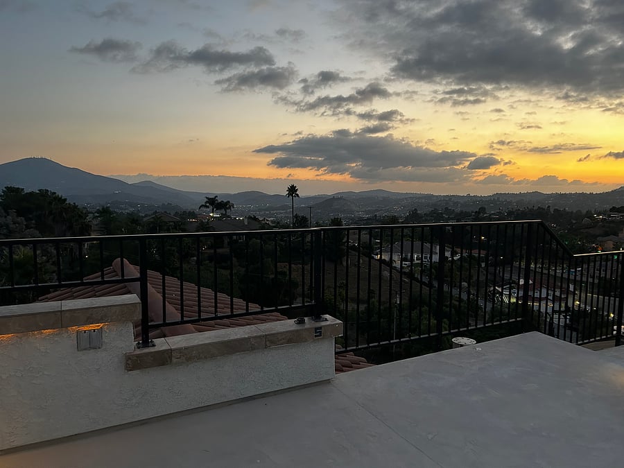 Large rooftop deck with couch, table and chairs. Enjoy the sunsets each night.
