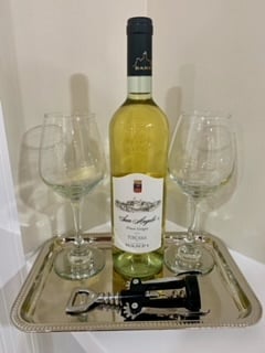 Have a glass of wine on us!