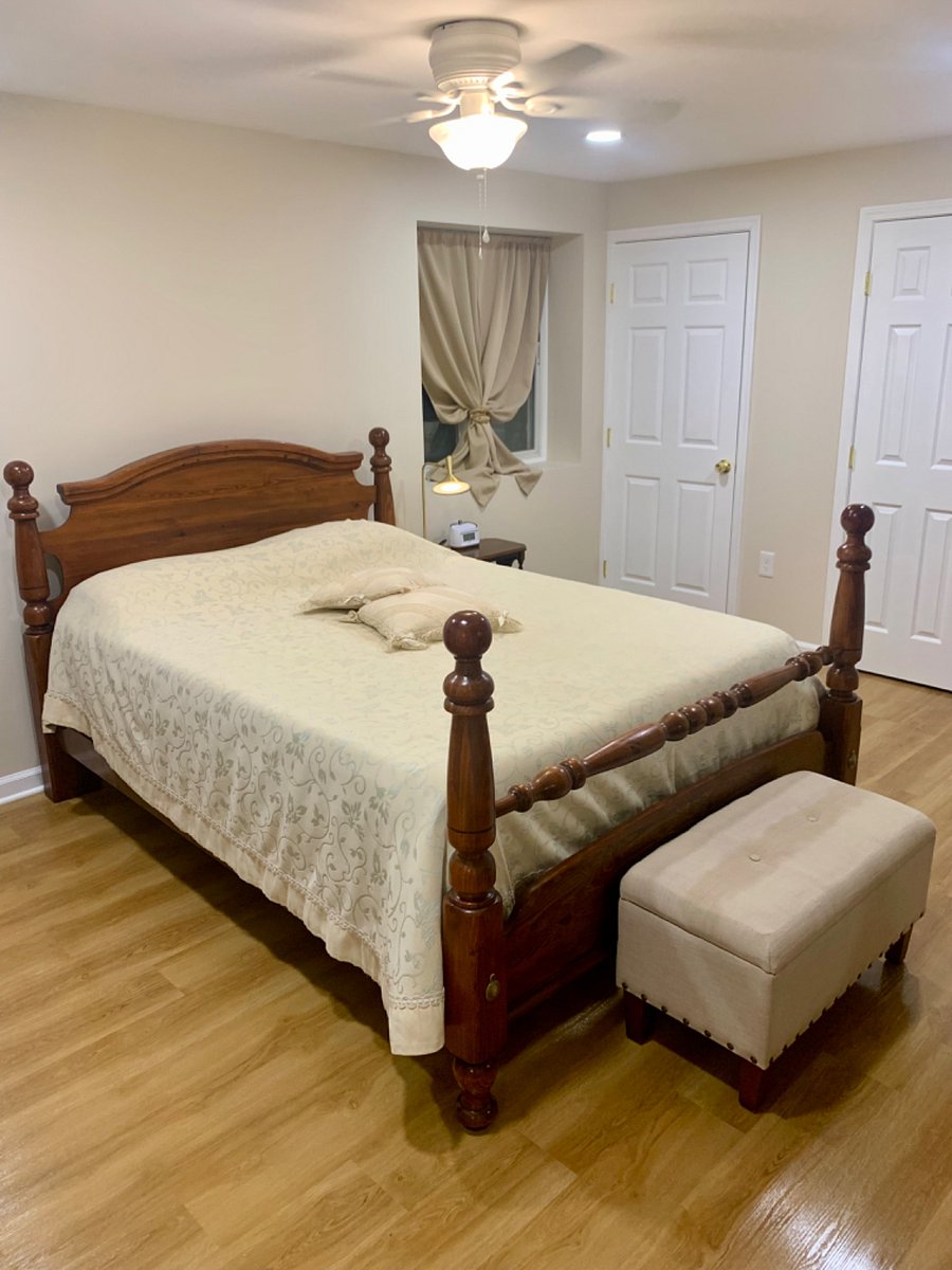 Queen Bed with night stand with a night light that has a dimmer, plus you can charge your phone at the same time. The projector alarm clock is a nice touch too.