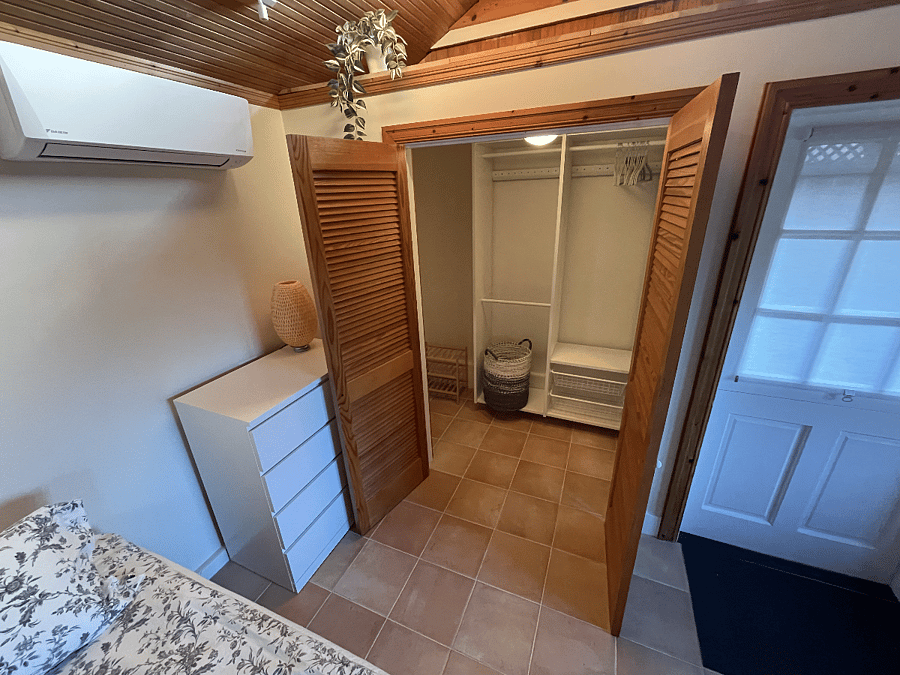 Walk-in closet from main room perspective. (Now has stacked Washer/Dryer on the right inside)