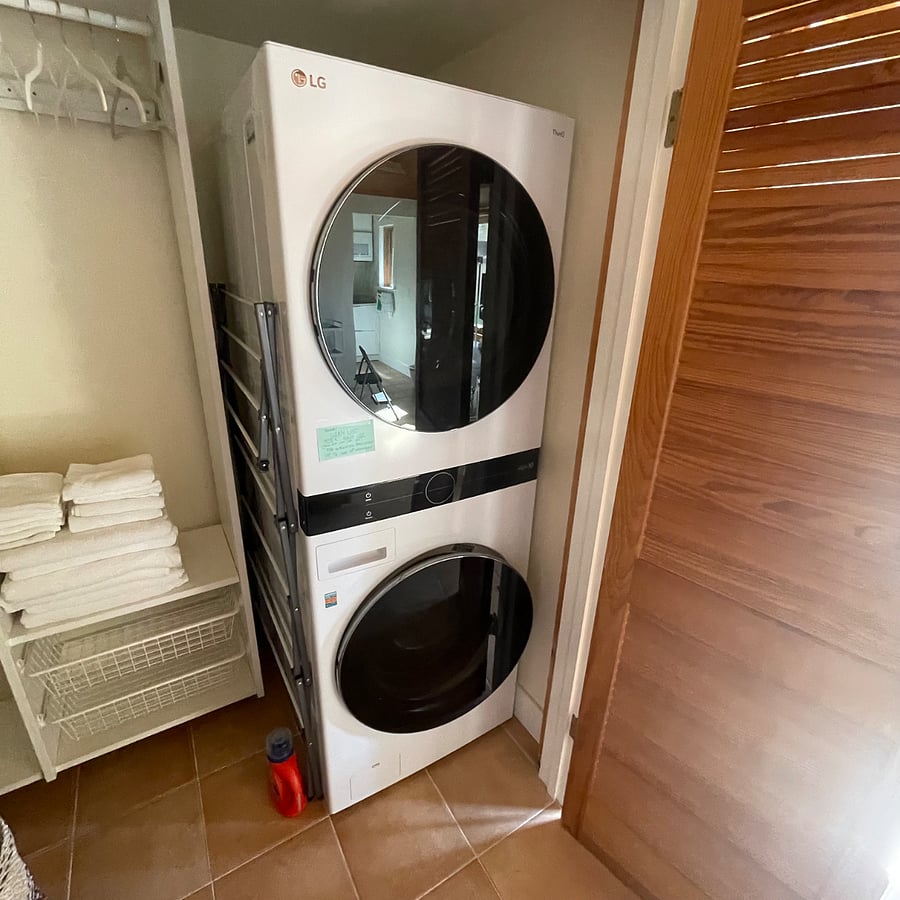 Updated picture of walk-in closet's new, in-unit LG WashTower stacked Washer/Dryer.