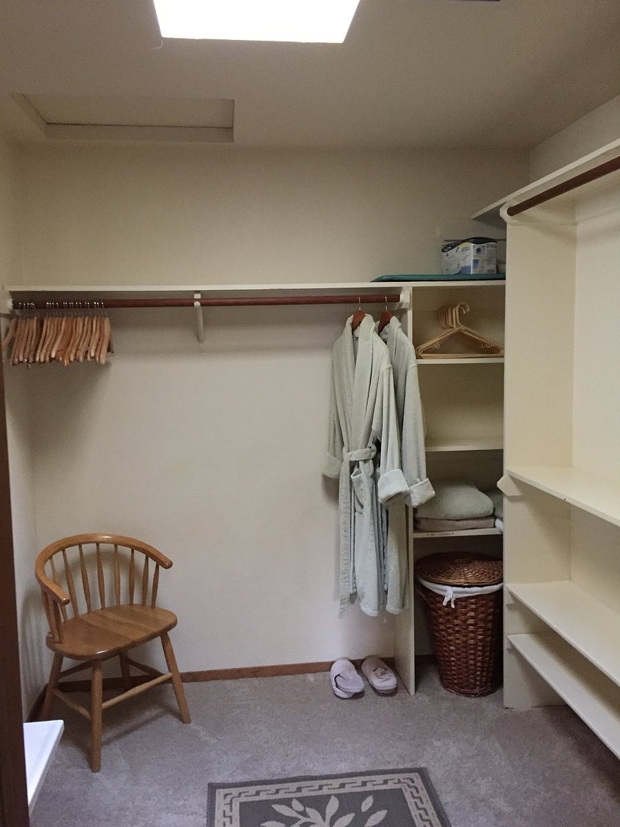 Large walk-in closet with skylight.