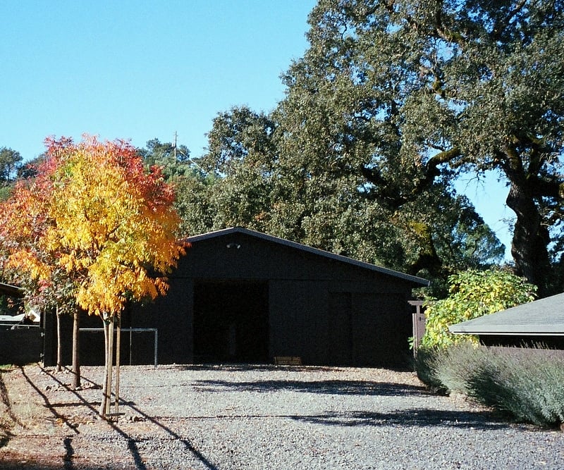Parking area is in front of this barn.