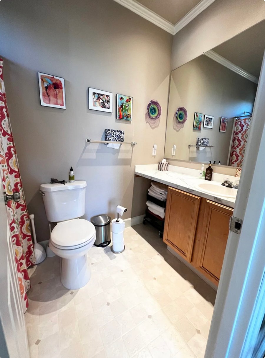 One of the two full bathrooms with a full tub and shower.