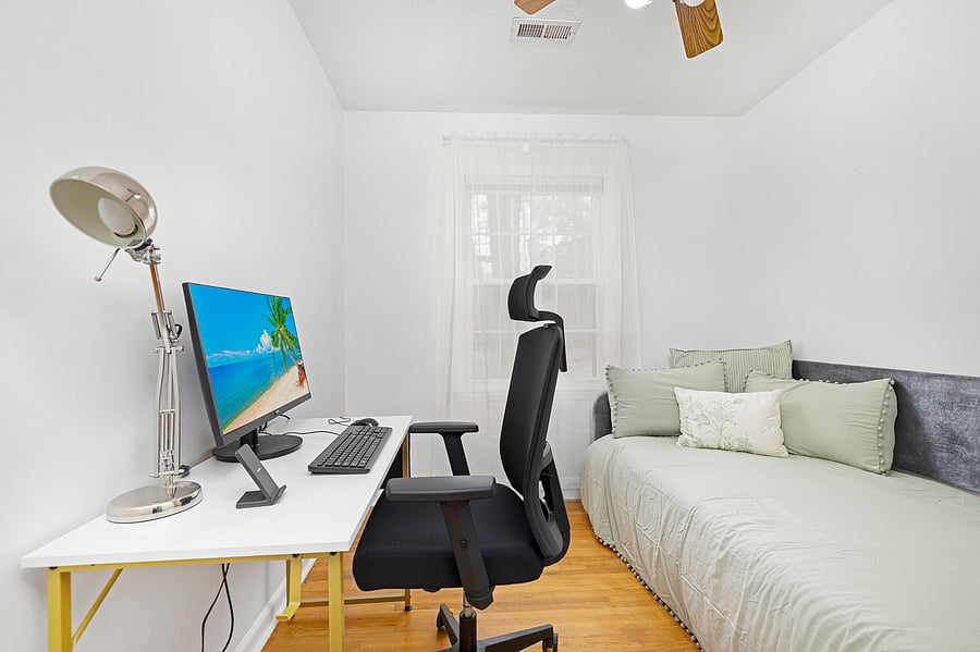 Ergonomically designed work space with a desk with monitor, keyboard and mouse available for your use. There is a twin bed in this room
