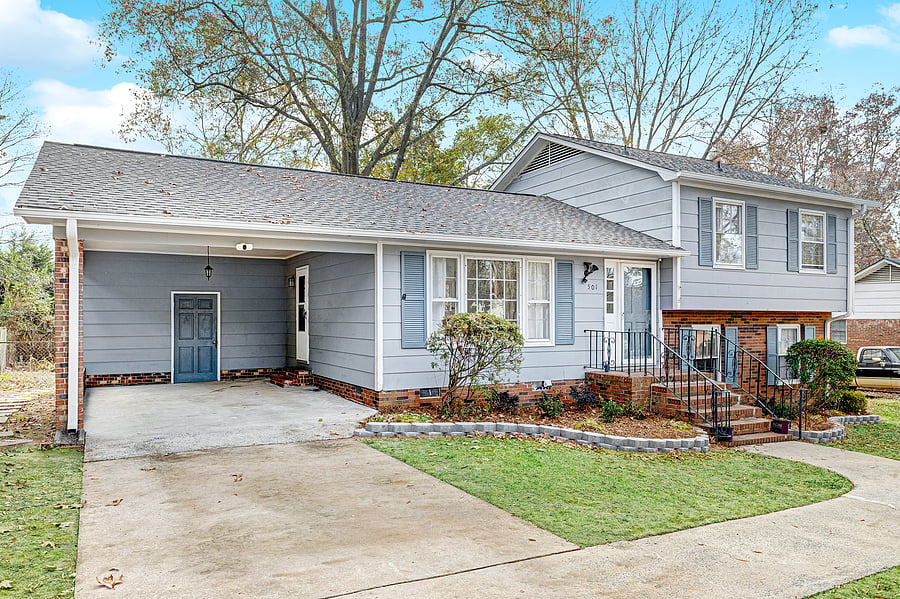 Exterior view of the house and carport