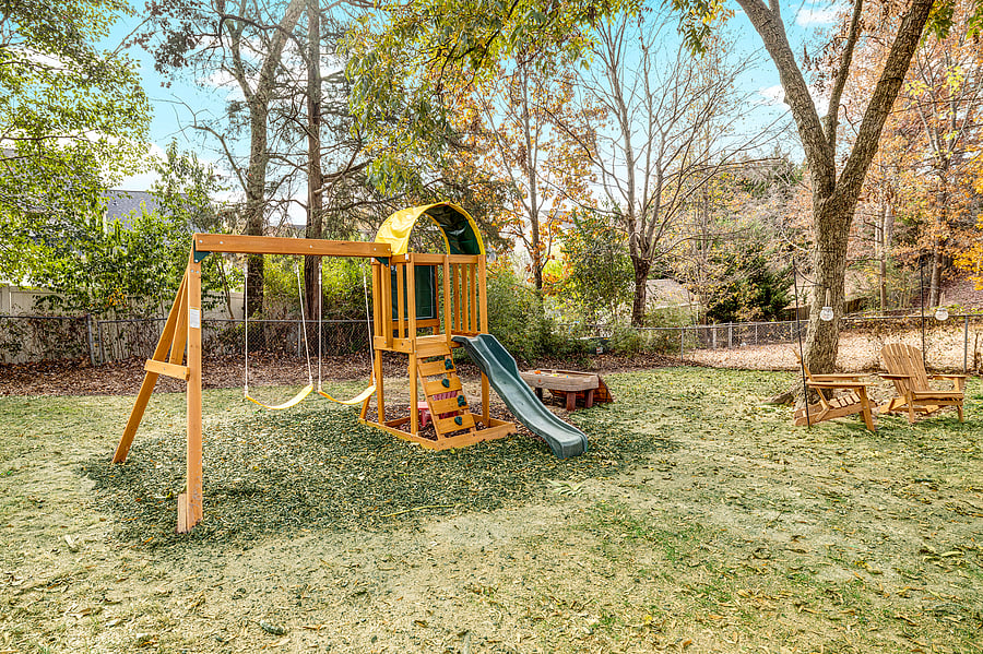 Play structure in the fully fenced backyard