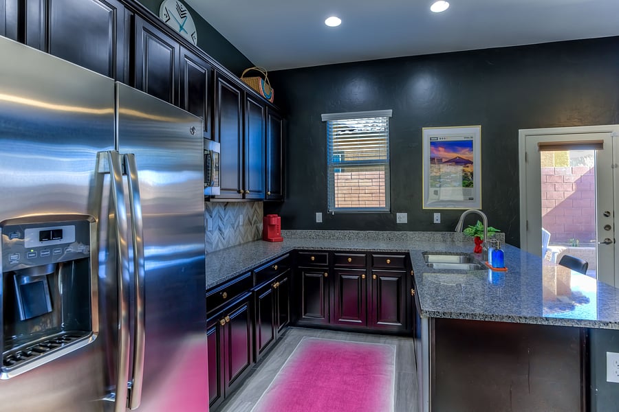 Kitchen has full size refrigerator, dishwasher, microwave/convection oven, hot plate for stove cooking, and in-sink disposal
