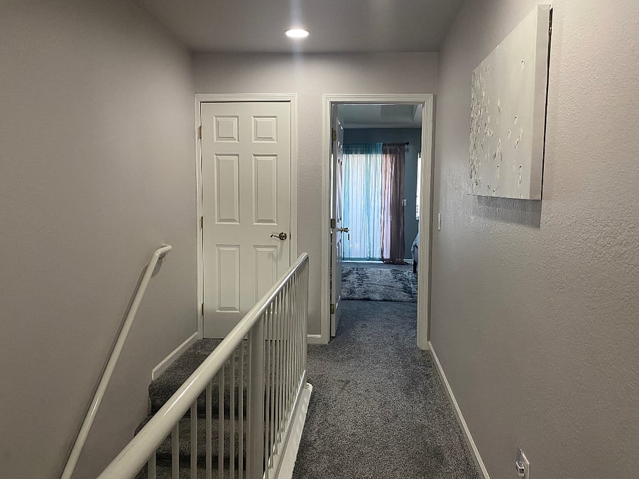 Stairs lead to the master bedroom.