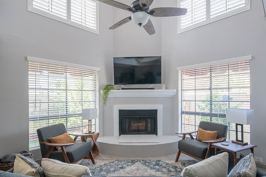 Samsung Smart TV and wood fireplace in living room.