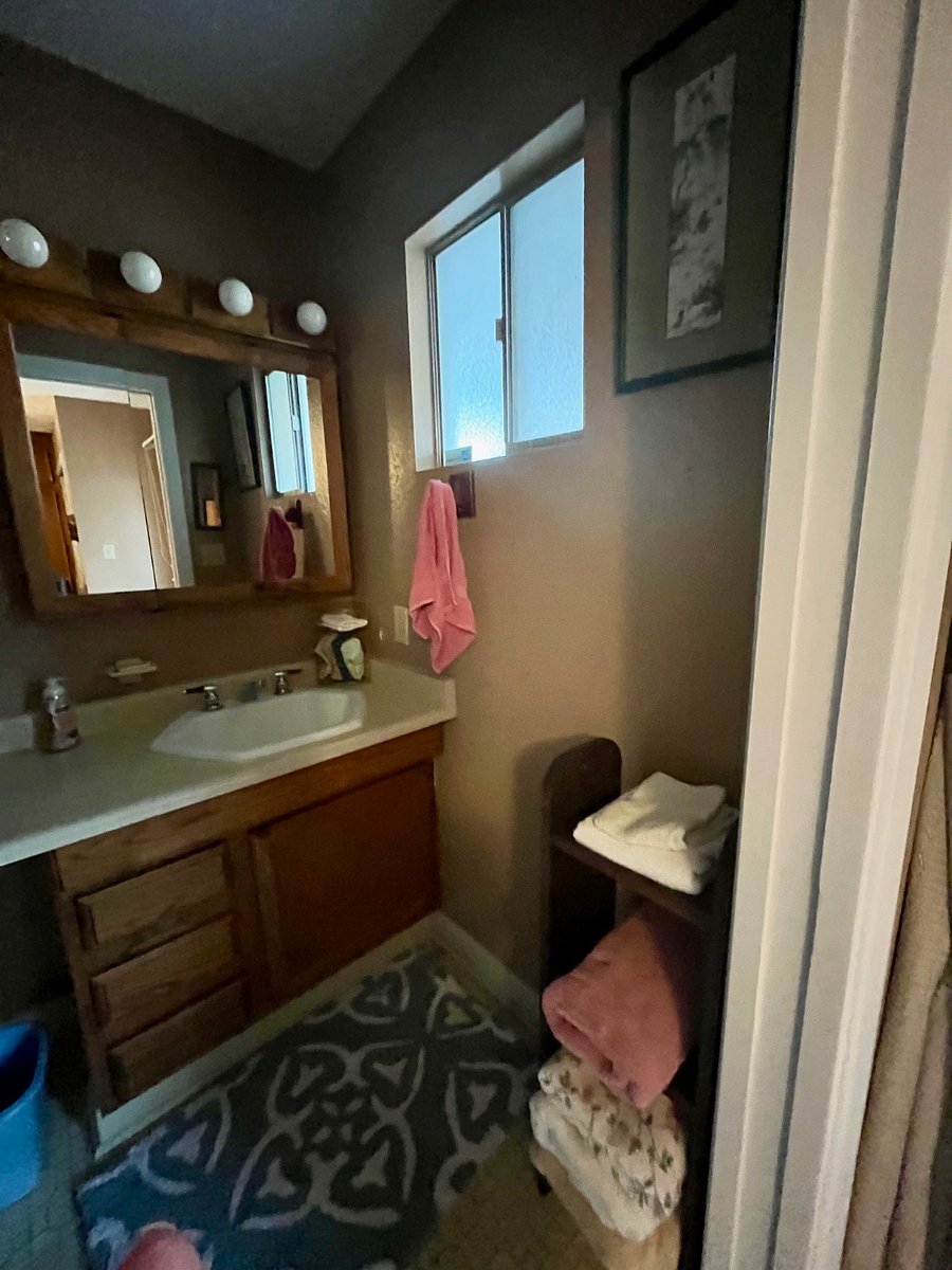 Bathroom has a nice window to the covered patio.