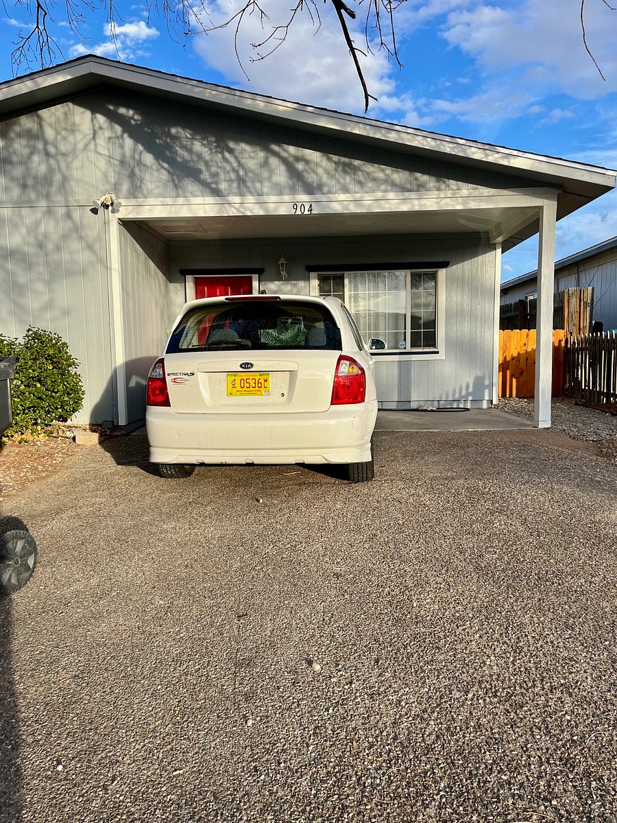 My parking space area. I can park farther to the left, and there's plenty of room for you to park to the right of the post close to the gate.