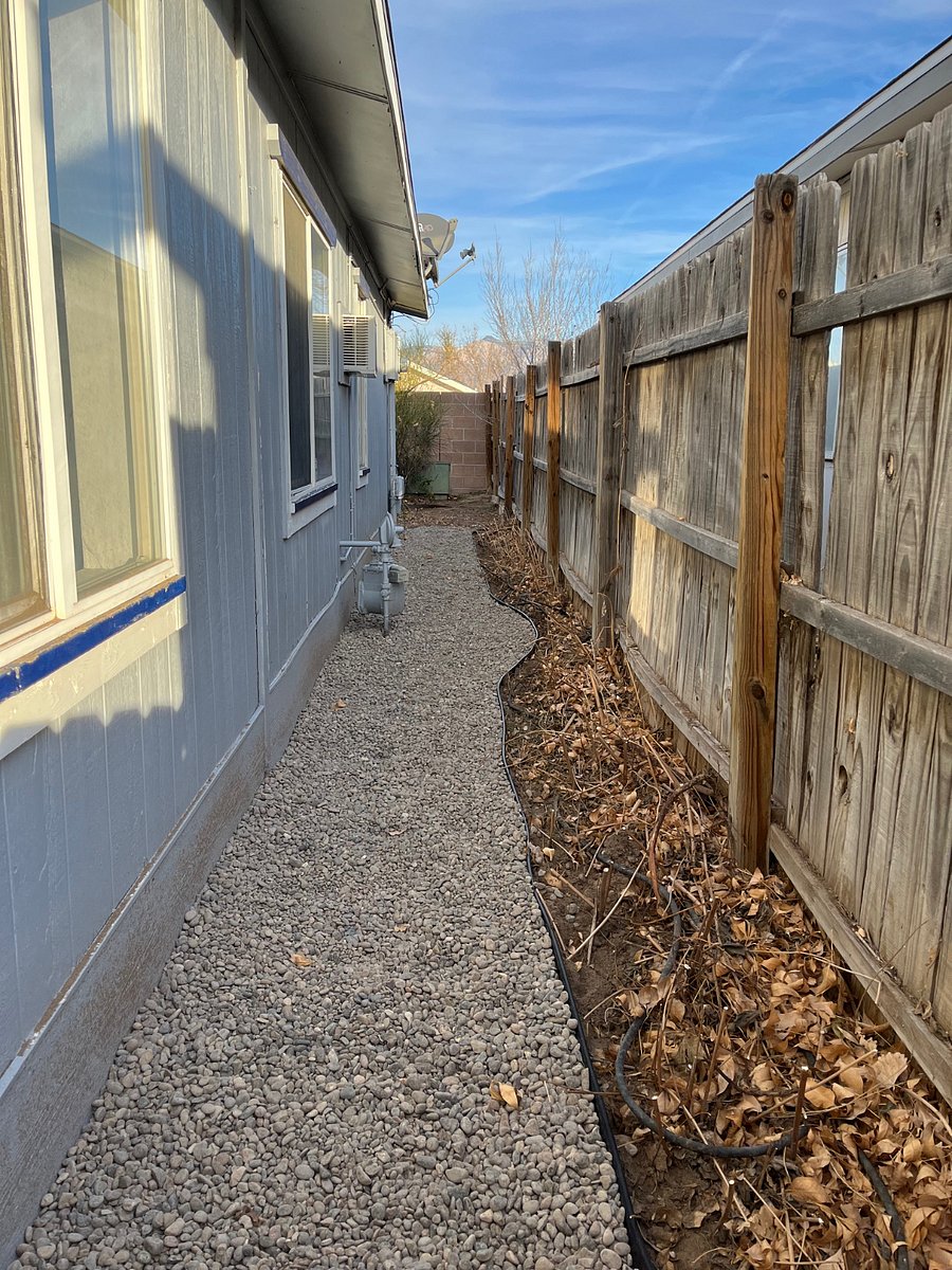Gravel walkway from front gate to back patio entrance.
