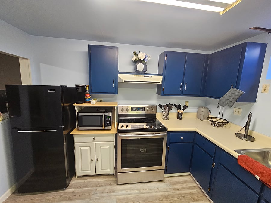 Medium fridge. Full size microwave, stove and oven 