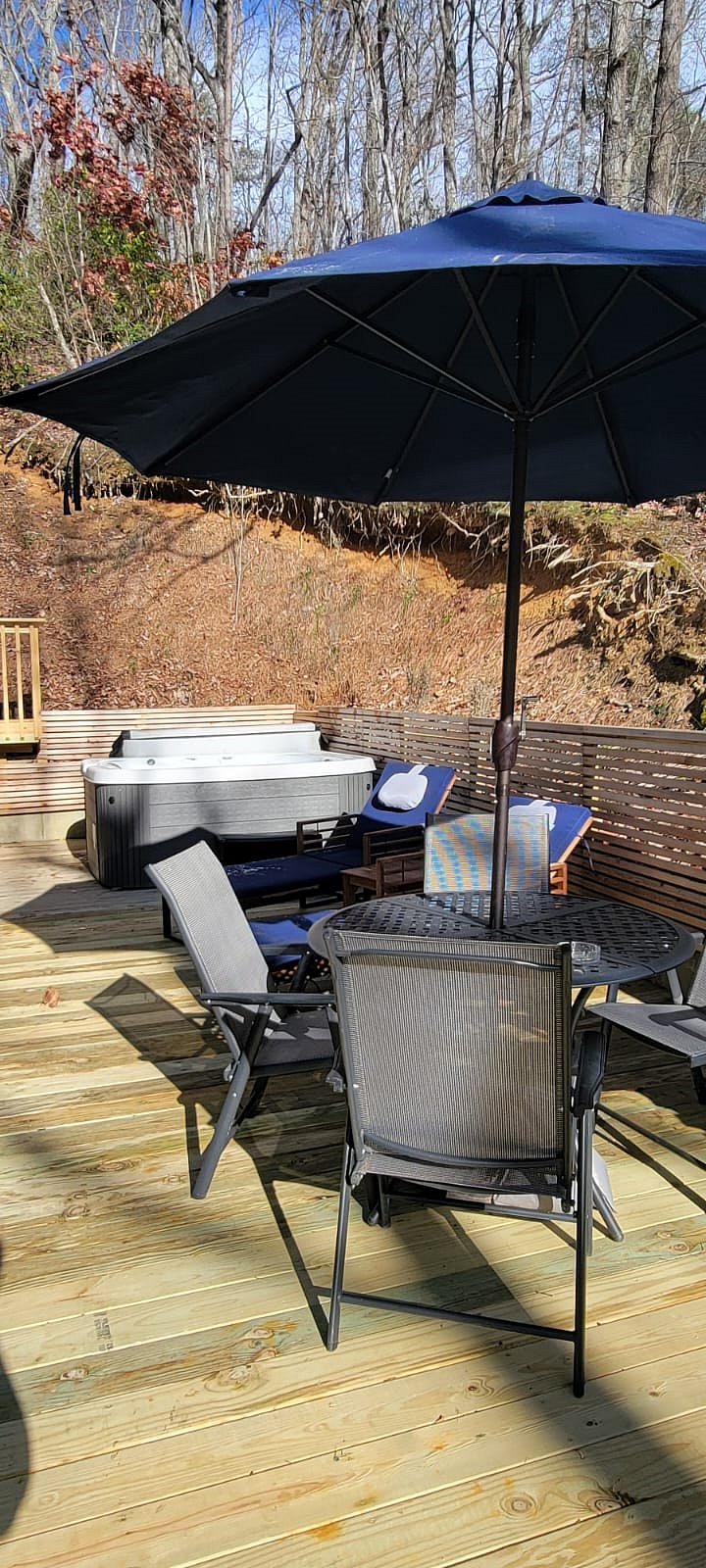 Hot tub, sunloungers, patio table on deck