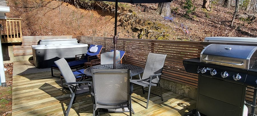 Patio table, hot tub, BBQ grill on deck