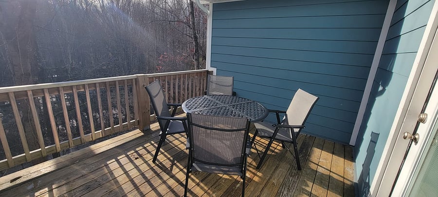Back porch with patio table and chairs