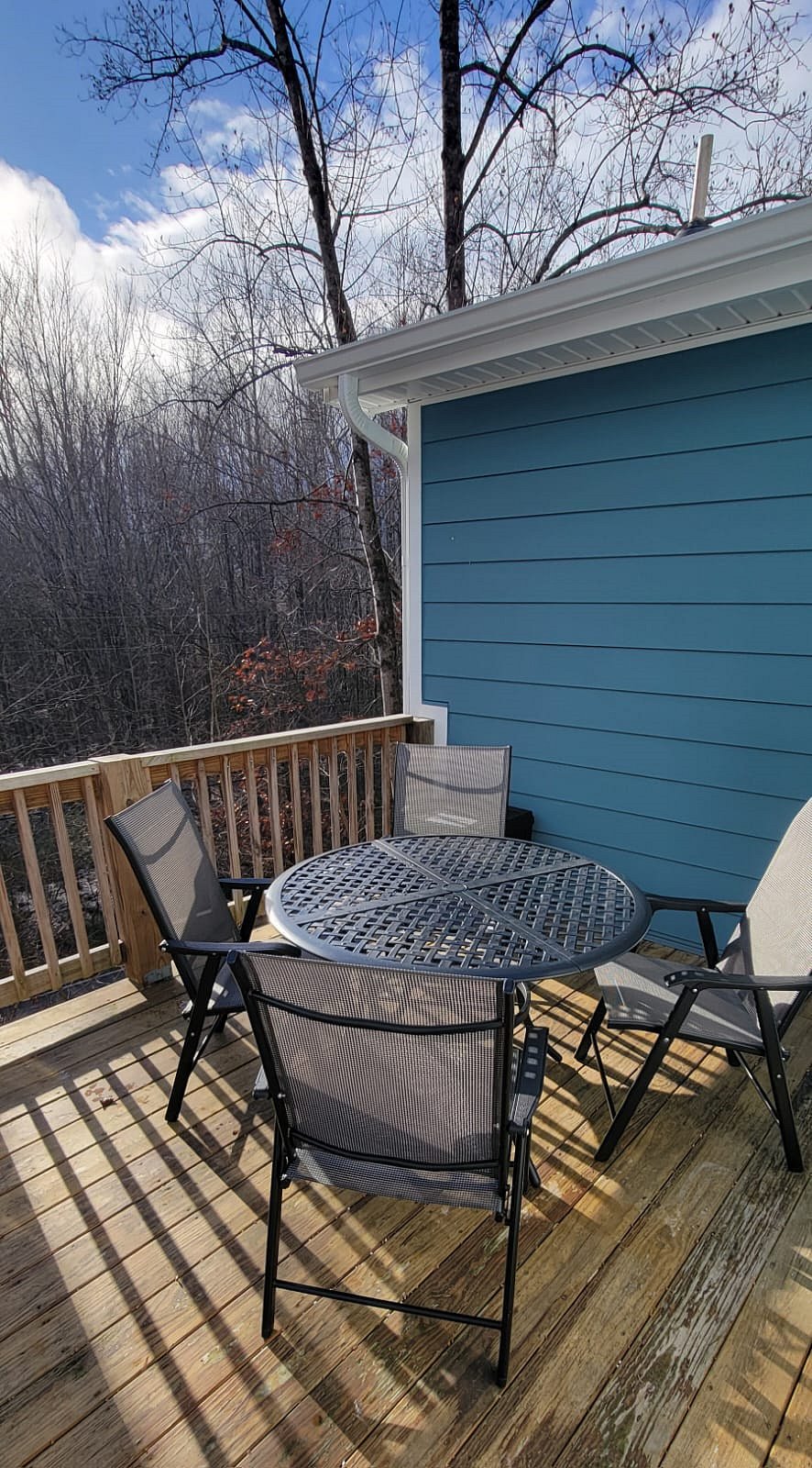 Back porch with patio table and chairs