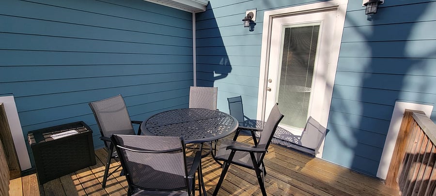 Back porch with patio table and chairs