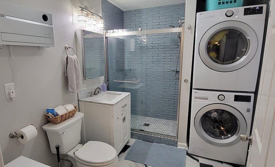 Master bathroom with shower and laundry area