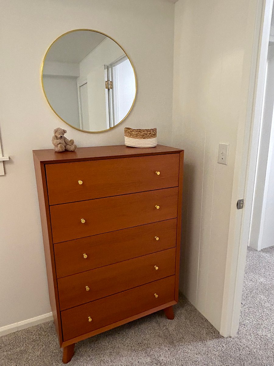 Five drawer bureau in queen bedroom
