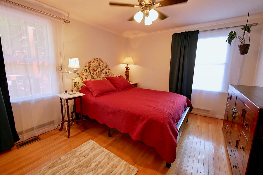 Master Bedroom with queen bed and blackout curtains
