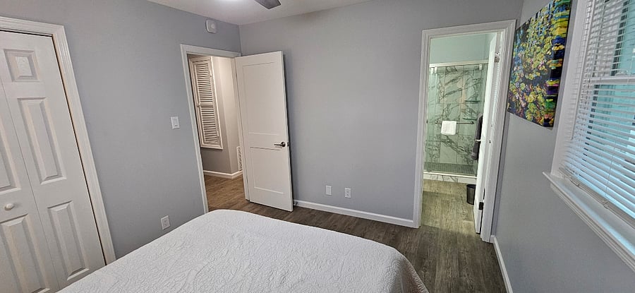 Primary bedroom - with view into master bathroom