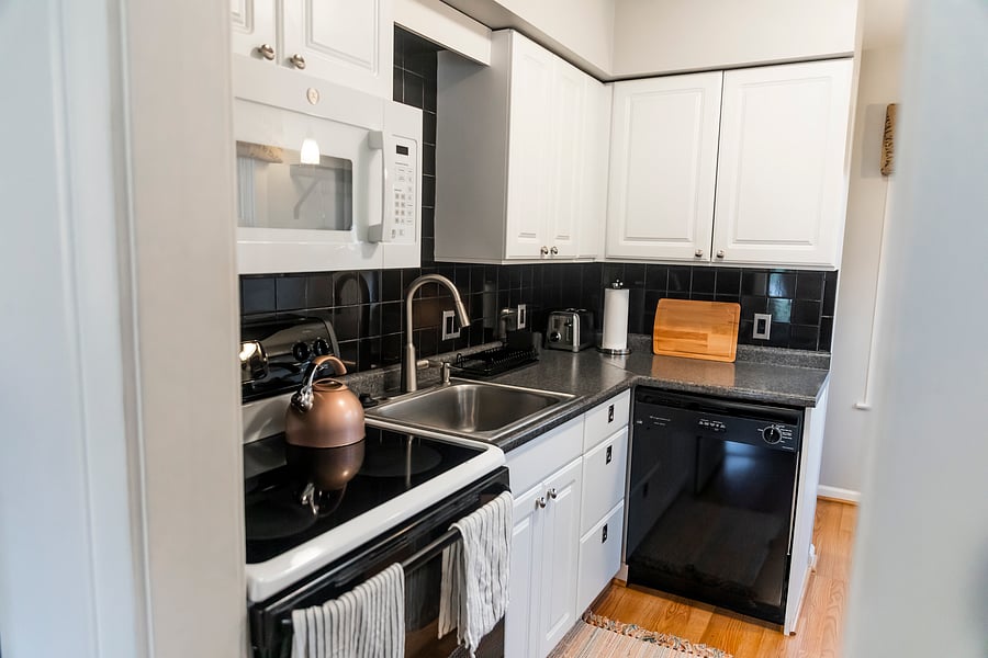Kitchen supplied with pots & pans, cooking utensils, plates, cups, spices, etc.