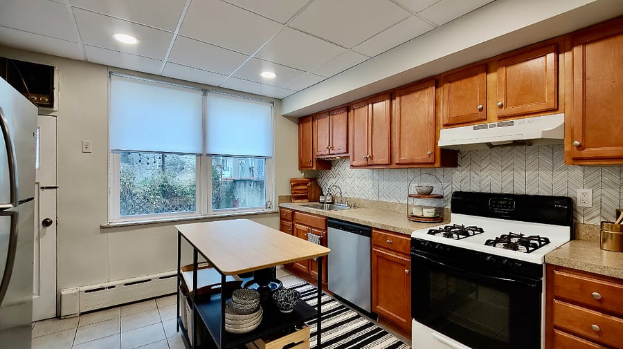 Kitchen stocked with keurig, ninja drip coffee maker, toaster oven, microwave, pots, pans and basic cooking essentials such as spices, sugar, coffee to get you started.