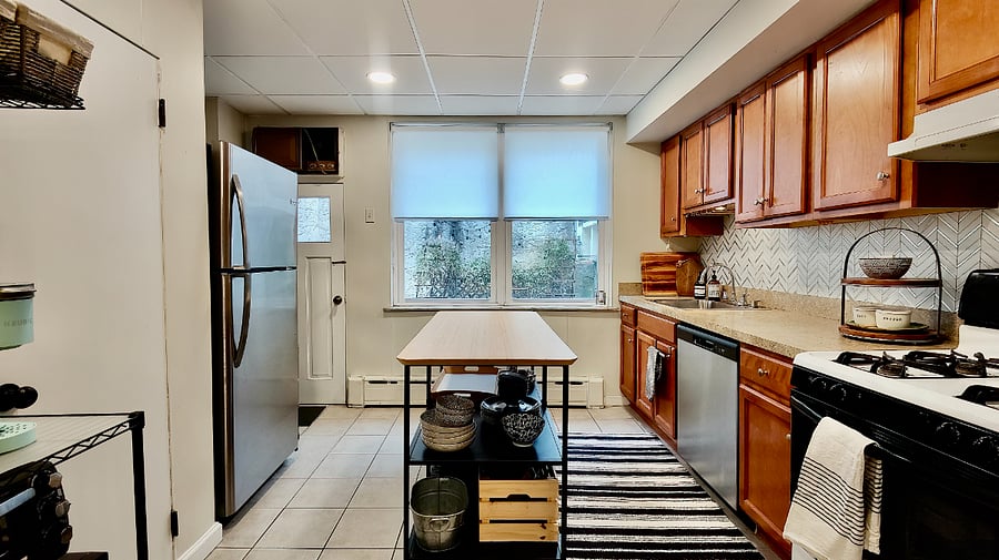 Kitchen stocked with keurig, ninja drip coffee maker, toaster oven, microwave, pots, pans and basic cooking essentials such as spices, sugar, coffee to get you started.