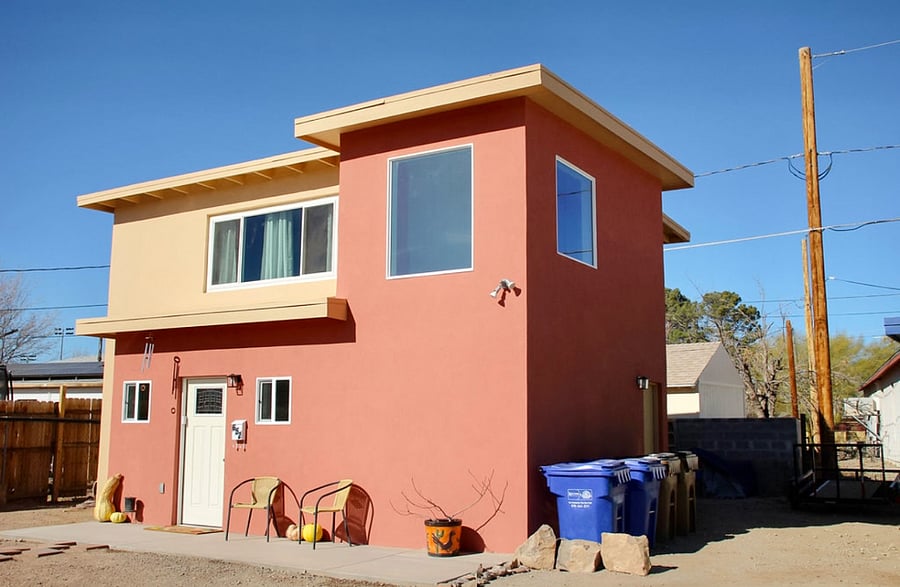 Side view of home where trash bins are located for your use.