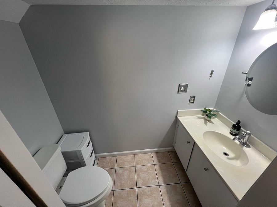 Studio bath: spacious toilet/vanity water closet section of bathroom. Great natural light + vanity light. tons of storage in vanity + extra storage drawers.