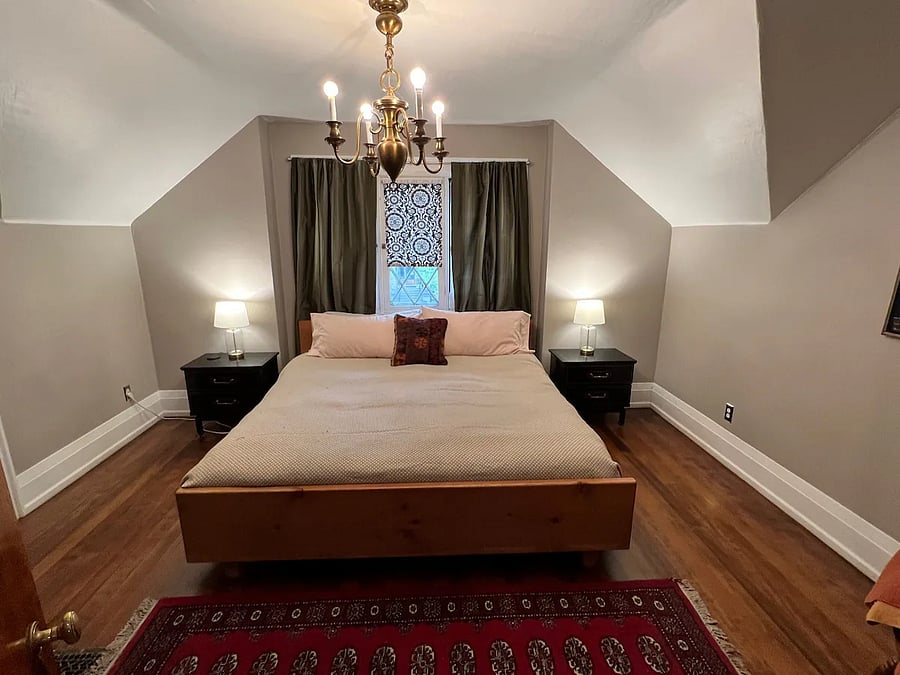 Upstairs bedroom with king bed. Portable AC unit available for Summer months. 