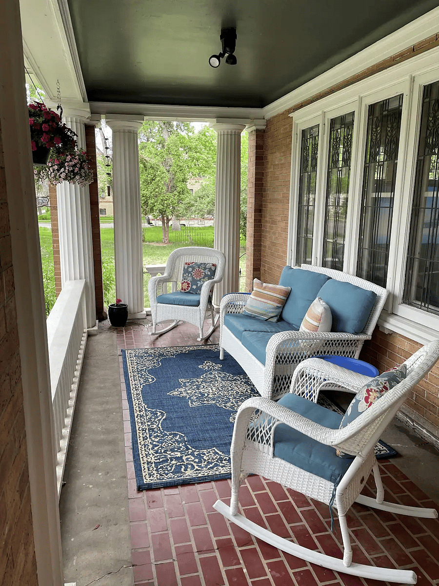 Large front porch with sitting area. 