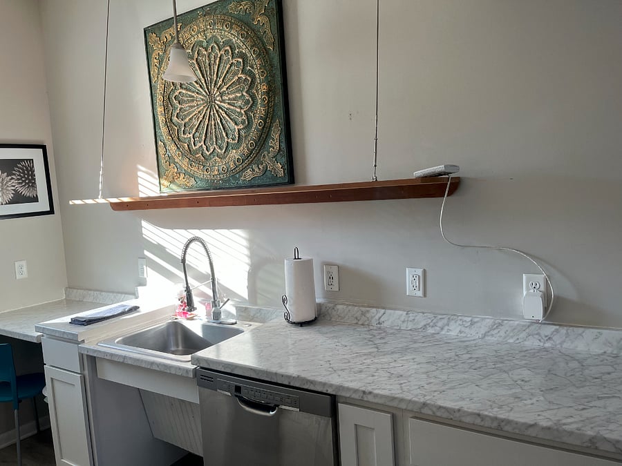 Full kitchen with dishwasher, frost free fridge with ice maker, microwave, full size range with oven, Gooseneck faucet on sink, fully stocked with pots, pans, dishes, and plenty of storage.